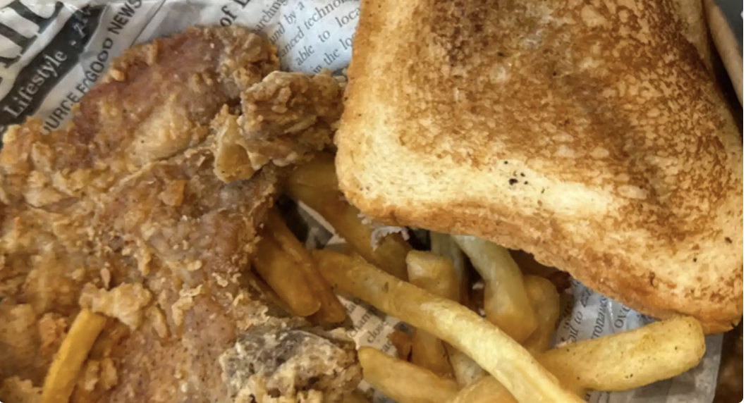 Fried fish with seasoned fries and toast